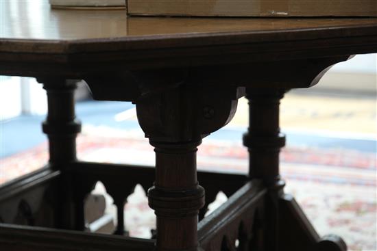 A Victorian gothic revival oak centre table, designed by Collier & Plucknett, Warwick, W.5ft D.5ft H.2ft 7in.